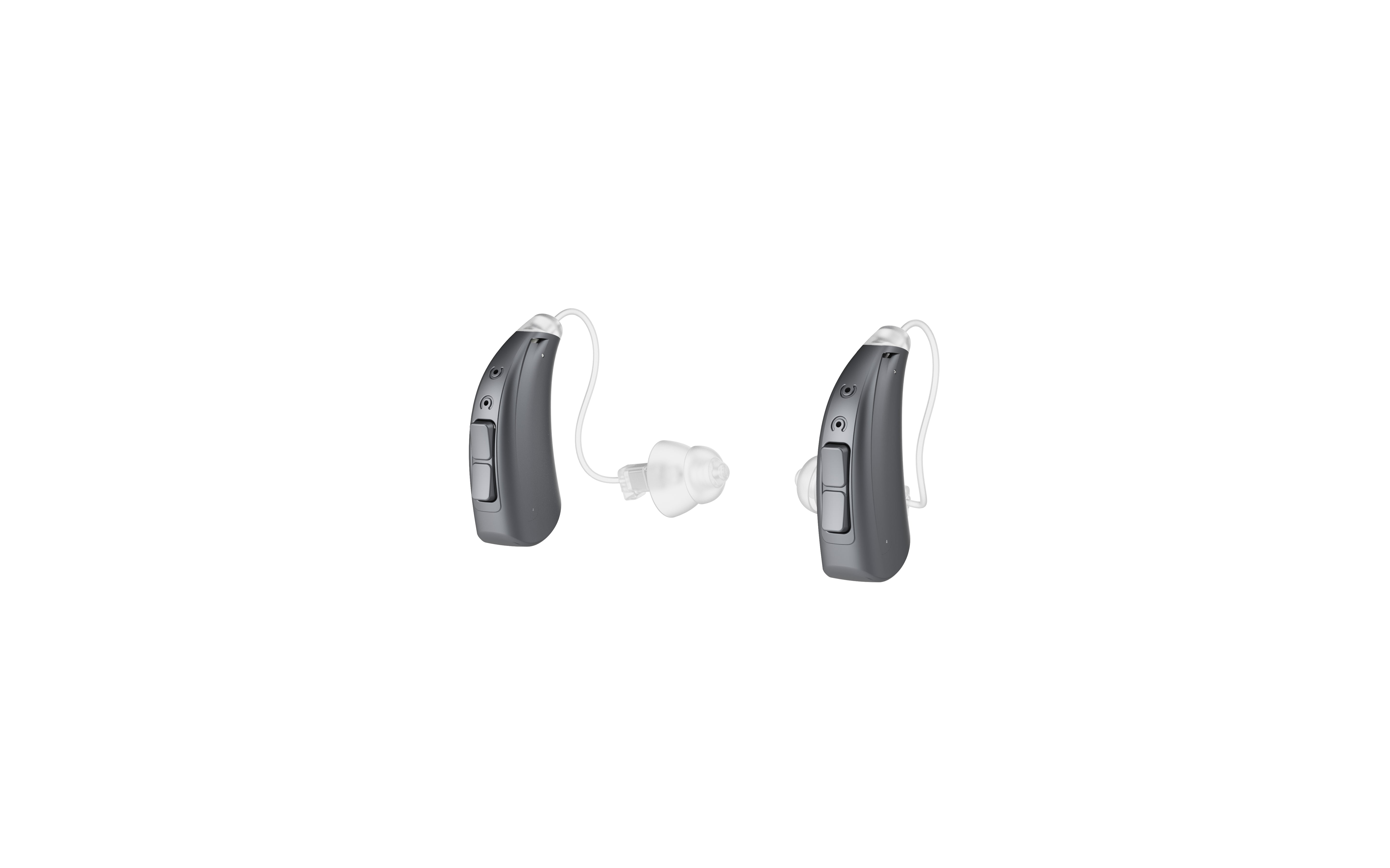 Hearing aids from the back showing volume toggle and power switch - black