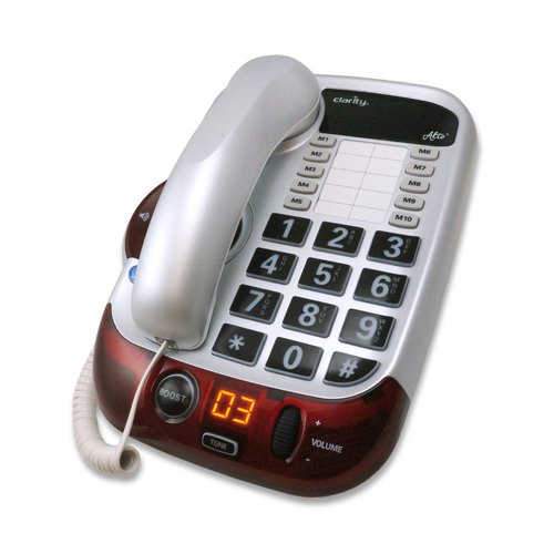 White corded phone with large keypad and volume control.